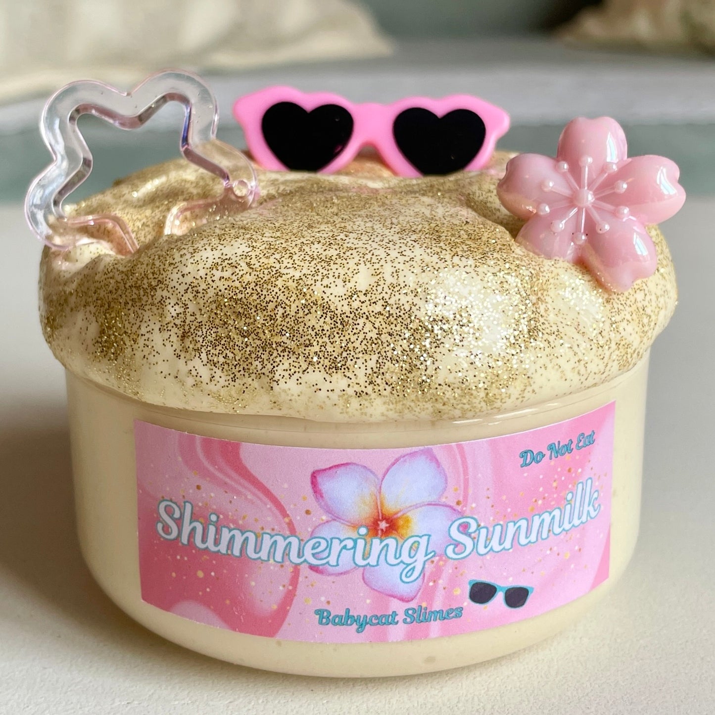 Shimmering gold creamy slime sunscreen theme with sunglasses charm