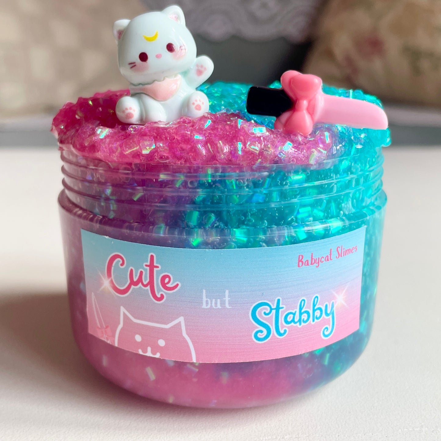 Pink and teal crunchy slime with cat charm