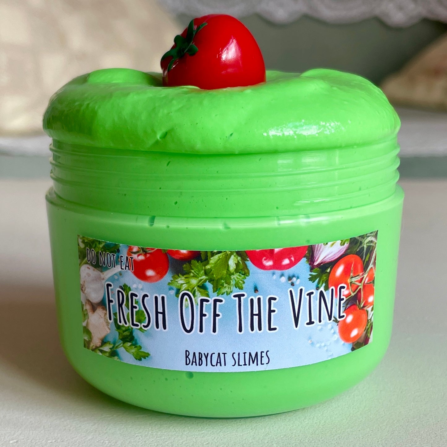 Vibrant green creamy slay slime with tomato charm
